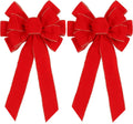 Two red velvet christmas bows with gold edge
